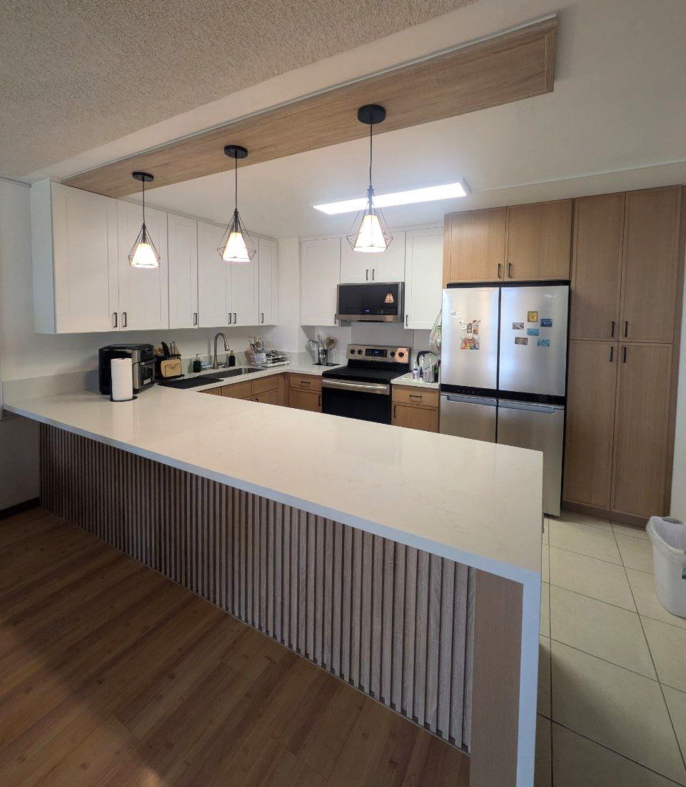 White shaker kitchen with oak slat peninsula, after