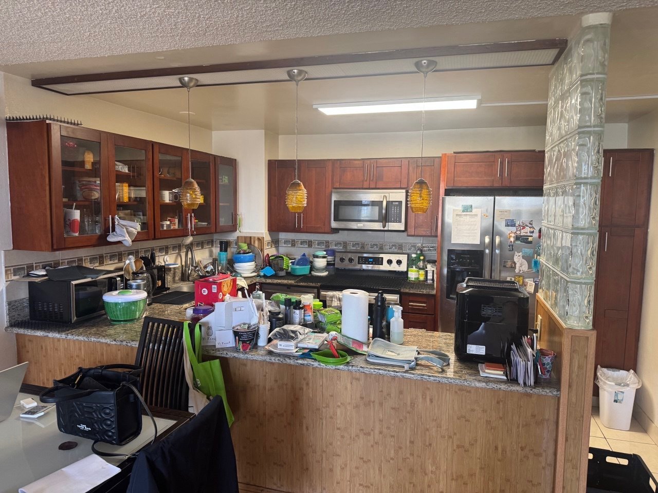 Dated cherry cabinets and glass block, before